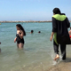 A woman goes swimming in France earlier this month. Image via Associated Press.